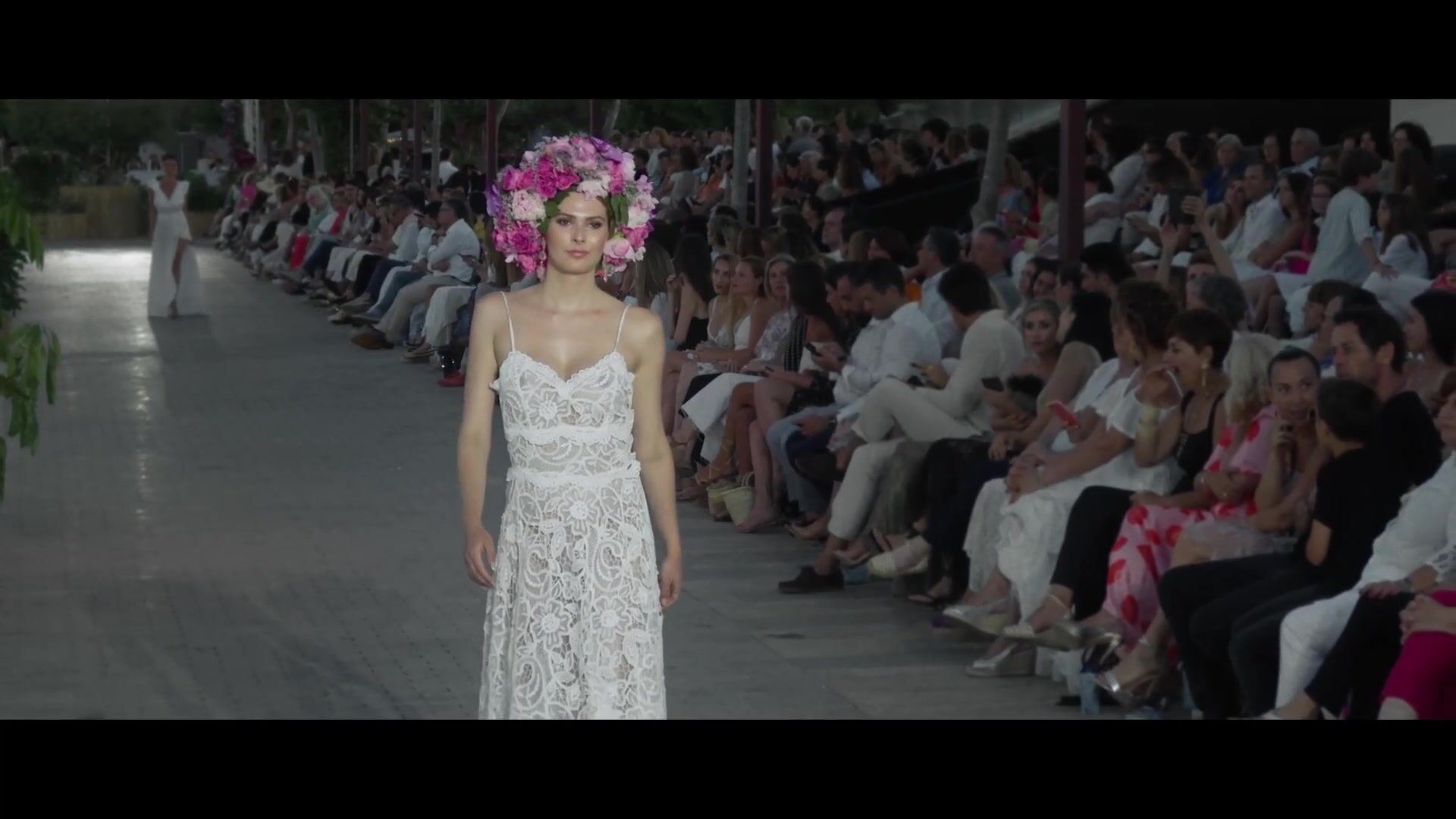 Model in a white dress and floral headpiece at ADLIB: an example of a vertical 9:16 crop for mobile